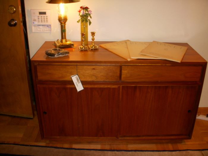 Danish modern cabinet.  Two drawers over two sliding doors.
