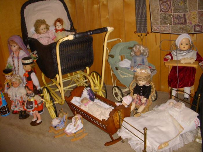 Dolls in buggies and beds
