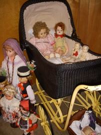 Dolls and a vintage wicker buggy