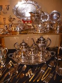 Silverplate.  In the center is the "Renaissance" tea set.  Above it are a covered vegetable, platter, sauce boat & pitcher, also in the "Renaissance" pattern