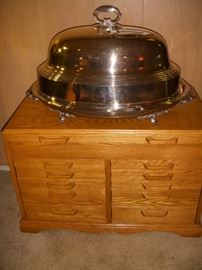 Cristofle oversize well-and-tree platter with hot water reservoir, and high dome.  This is silverplate.  It is shown on a good-sized oak silver chest with Pacific cloth lined drawers.  See following pictures....