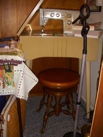 Sewing machine and old piano stool