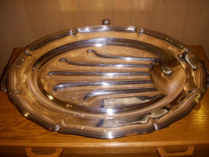 The Cristofle "Well and tree" platter.  Note, there are scratches on the surface where meat has been carved