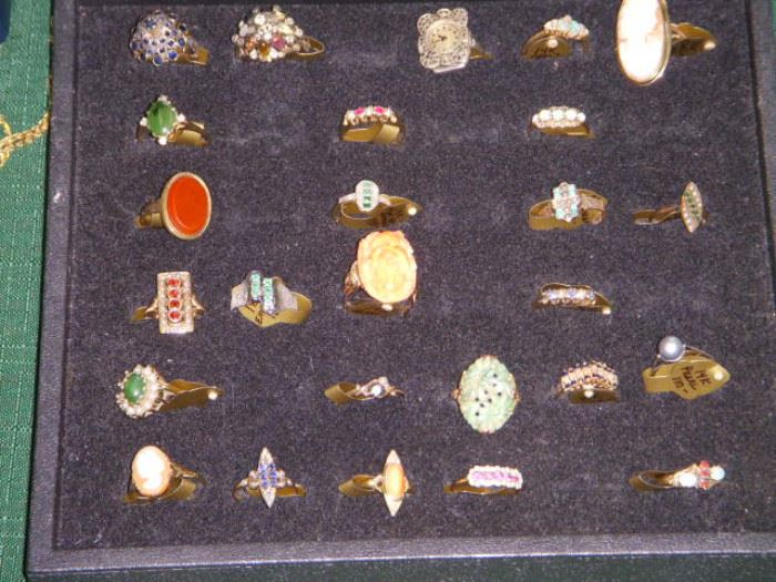 Gold rings with various precious and semi-precious stones