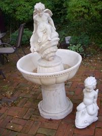 Fountain is resin (had not pump).  The cherub on dolphin is cement