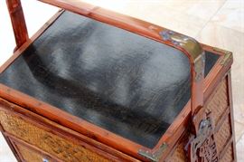 Chinese Handpainted Medicine Box

To top of handle, stands 24"tall x 17"wide x 11 1/2"deep. Handcrafted and handpainted. Intricate scroll design on top and on the wicker. 8 drawers, 4 on each side. 