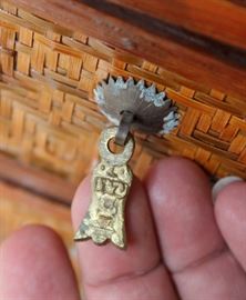 Chinese Handpainted Medicine Box

To top of handle, stands 24"tall x 17"wide x 11 1/2"deep. Handcrafted and handpainted. Intricate scroll design on top and on the wicker. 8 drawers, 4 on each side. 