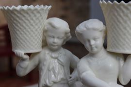Belleek Irish Porcelain Basket Bearer Boy and Girl Mantle Candle Holders

Each measure 8 1/2"tall. A fabulous pair of Belleek Ireland spill vase parian china figurines. All Belleek porcelain is crafted and painted entirely by hand, with love and care, at the Belleek Studio, County Fermanagh, Ireland. Beautiful cream glaze parian china, 18th century dressed Welsh boy and girl holding a weave basket spill vase, perfect mantel figurines.