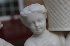 Belleek Irish Porcelain Basket Bearer Boy and Girl Mantle Candle Holders

Each measure 8 1/2"tall. A fabulous pair of Belleek Ireland spill vase parian china figurines. All Belleek porcelain is crafted and painted entirely by hand, with love and care, at the Belleek Studio, County Fermanagh, Ireland. Beautiful cream glaze parian china, 18th century dressed Welsh boy and girl holding a weave basket spill vase, perfect mantel figurines.