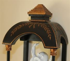 Buddha Stand

Pretty Asian-themed wall hanging, 3-shelved unit with Buddha figurine and vase as shown in pictures. Measures 46"tall x 9 1/2"wide x 7 1/2"deep. Buddha figurine is 9 1/2"tall. Overall very good condition. Black painted with copper-toned trim. No identifying markings on the Buddha figure. 