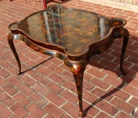 Beautiful Handpainted Side Table

Japanned. Measures 24"tall x 38"wide x 29"deep. Handpainted by: Maitland-Smith LTD. Small sticker on bottom reads: Handmade in Phillipines. Another sticker has written on it: 2543-220. Very beautiful, has pad feet and floral design top with birds. 