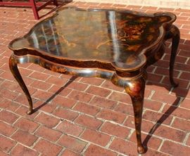 Beautiful Handpainted Side Table

Japanned. Measures 24"tall x 38"wide x 29"deep. Handpainted by: Maitland-Smith LTD. Small sticker on bottom reads: Handmade in Phillipines. Another sticker has written on it: 2543-220. Very beautiful, has pad feet and floral design top with birds. 