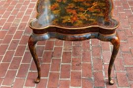 Beautiful Handpainted Side Table

Japanned. Measures 24"tall x 38"wide x 29"deep. Handpainted by: Maitland-Smith LTD. Small sticker on bottom reads: Handmade in Phillipines. Another sticker has written on it: 2543-220. Very beautiful, has pad feet and floral design top with birds. 