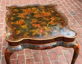Beautiful Handpainted Side Table

Japanned. Measures 24"tall x 38"wide x 29"deep. Handpainted by: Maitland-Smith LTD. Small sticker on bottom reads: Handmade in Phillipines. Another sticker has written on it: 2543-220. Very beautiful, has pad feet and floral design top with birds. 