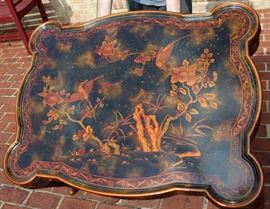 Beautiful Handpainted Side Table

Japanned. Measures 24"tall x 38"wide x 29"deep. Handpainted by: Maitland-Smith LTD. Small sticker on bottom reads: Handmade in Phillipines. Another sticker has written on it: 2543-220. Very beautiful, has pad feet and floral design top with birds. 