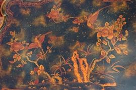 Beautiful Handpainted Side Table

Japanned. Measures 24"tall x 38"wide x 29"deep. Handpainted by: Maitland-Smith LTD. Small sticker on bottom reads: Handmade in Phillipines. Another sticker has written on it: 2543-220. Very beautiful, has pad feet and floral design top with birds. 