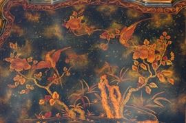 Beautiful Handpainted Side Table

Japanned. Measures 24"tall x 38"wide x 29"deep. Handpainted by: Maitland-Smith LTD. Small sticker on bottom reads: Handmade in Phillipines. Another sticker has written on it: 2543-220. Very beautiful, has pad feet and floral design top with birds. 