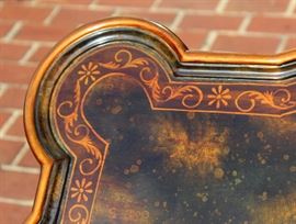 Beautiful Handpainted Side Table

Japanned. Measures 24"tall x 38"wide x 29"deep. Handpainted by: Maitland-Smith LTD. Small sticker on bottom reads: Handmade in Phillipines. Another sticker has written on it: 2543-220. Very beautiful, has pad feet and floral design top with birds. 