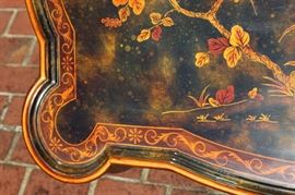 Beautiful Handpainted Side Table

Japanned. Measures 24"tall x 38"wide x 29"deep. Handpainted by: Maitland-Smith LTD. Small sticker on bottom reads: Handmade in Phillipines. Another sticker has written on it: 2543-220. Very beautiful, has pad feet and floral design top with birds. 