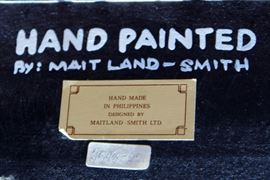 Beautiful Handpainted Side Table

Japanned. Measures 24"tall x 38"wide x 29"deep. Handpainted by: Maitland-Smith LTD. Small sticker on bottom reads: Handmade in Phillipines. Another sticker has written on it: 2543-220. Very beautiful, has pad feet and floral design top with birds. 