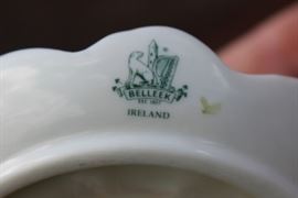  Belleek Porcelain Collection

Includes 8 pieces of fine Irish Beleek Porcelain.

1 Carlingford Cache Pot, 5 3/4"tall
1 "Happy Anniversary" Plate, 9" diameter
1 vine clock, 7 1/2"tall
1 ring holder
1 house-shaped ornament, inside marked "Thirteenth Edition"
1 Claddagh Make-Up Bell
1 leprechaun figurine, 5"tall
1 "Himself" titled mug, 4 3/4"tall

All pieces are in very good condition, no wearing of paint or chipping of ceramics. 