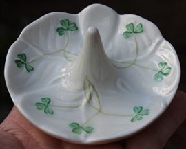  Belleek Porcelain Collection

Includes 8 pieces of fine Irish Beleek Porcelain.

1 Carlingford Cache Pot, 5 3/4"tall
1 "Happy Anniversary" Plate, 9" diameter
1 vine clock, 7 1/2"tall
1 ring holder
1 house-shaped ornament, inside marked "Thirteenth Edition"
1 Claddagh Make-Up Bell
1 leprechaun figurine, 5"tall
1 "Himself" titled mug, 4 3/4"tall

All pieces are in very good condition, no wearing of paint or chipping of ceramics. 