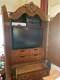 armoire used as tv cabinet