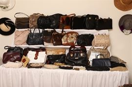 More than fifty good handbags, many with designer labels.