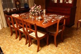 Cherry table and six chairs.