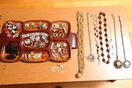 Lots of costume jewelry, the better pieces in a display case.