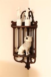 Corner shelf with Staffordshire dog.