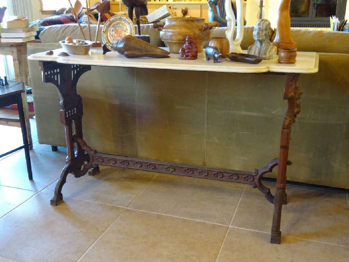 Cast iron base and marble top; carved wooden items