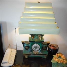 I love this clock lamp. Very old 