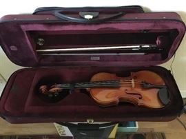 Fine violin by Rudolf Buchner of Germany dated 1961with maple back & neck & spruce top in Stradivarius-style in very good condition. The vintage bow of the early 1900s, also in very good condition, by Adolf Schuster of Germany, made of pernambuco with ebony, silver, mother of pearl & ivory tip;  like-new shoulder rest & zippered, padded case