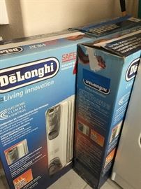 3 or 4 DeLonghi room heaters.
