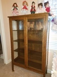 Tiger oak 2 door curio, more of the doll collection.