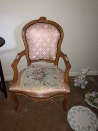 pink chair and needlepoint piece