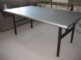 Designer heavy duty aluminum 3'x 6' table with collapsible legs.