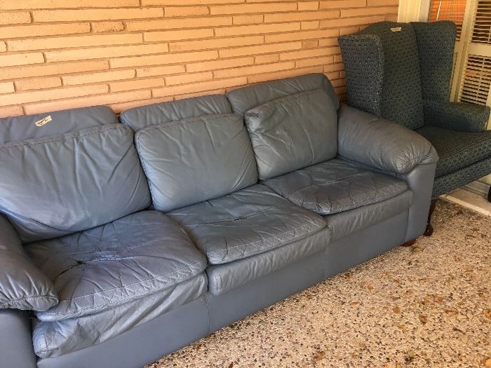 leather center sofa bad shape  -any offer  have matching chair - which is in great shape- not sure how that happened  but couch is cheap- needs cushion replacement 
