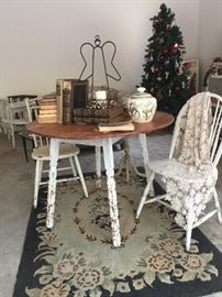 What a great shabby chic farmhouse table, antique books and chairs