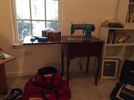 Sewing machine, cabinet and supplies