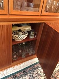 Danish Modern teak display cabinet by Skovby Mobelfabrik.  Two piece, glass doors lift off for easy transporting.  Overall dimensions 80.5" wide, 19" deep, 71.75" tall.  Excellent condition