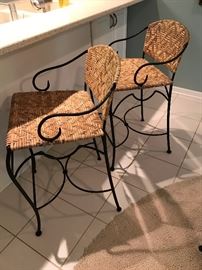Pair of ornate iron counter height chairs