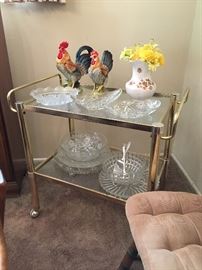 Vintage metal tea cart with nice serving pieces.