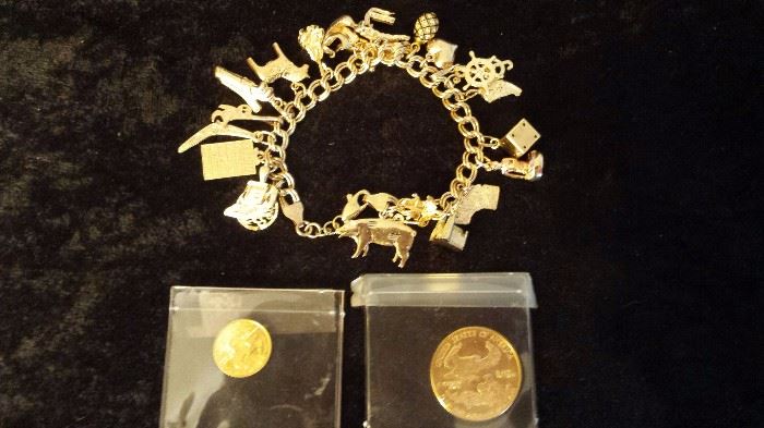 14kt gold charm bracelet and 2 1986 fine gold coins
