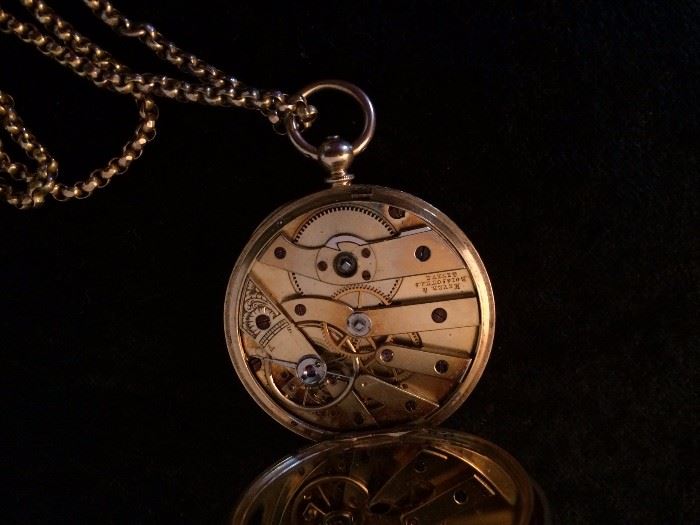 antique pocket watch showing the guts/interior