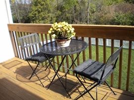 Wrought iron fold up chairs and table