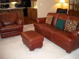 Leather Sofa/couch, reclining chair and ottoman. Leather chair in corner, china cabinet