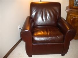 Leather Sofa/couch, reclining chair and ottoman. Leather chair in corner, china cabinet
