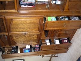 Entertainment cabinet lighted glass front, slide out spaces for dvd/vhs/cd's